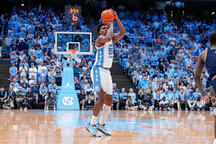 North Carolina Tar Heels forward Harrison Ingram shoots a three-point shot against the Notre Dame Fighting Irish.